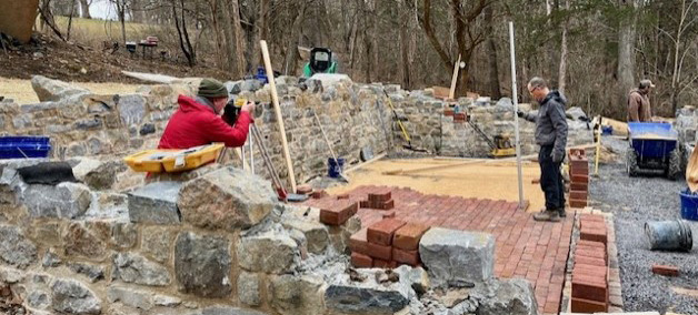 Stone masons restoring Liberty Hall Structure 9 Foundation